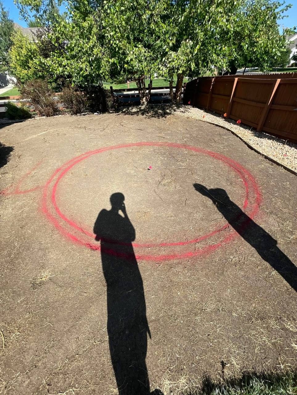 Before — bare dirt backyard