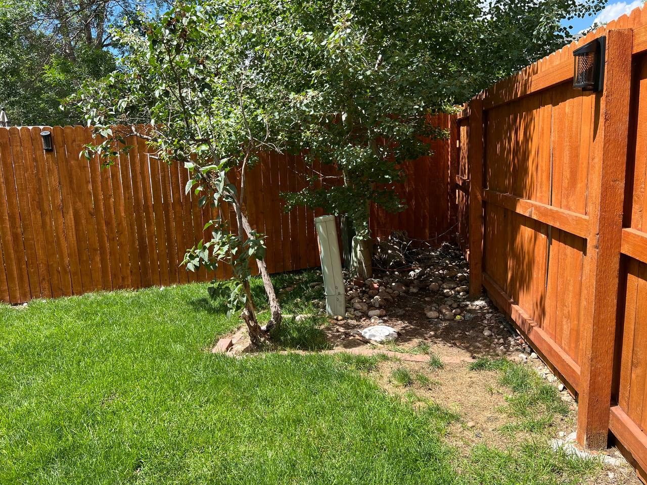 Corner bed retaining wall — before
